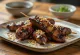 Reba Yakitori Hähnchenleber am Spieß serviert, mit Sesam und Frühlingszwiebeln